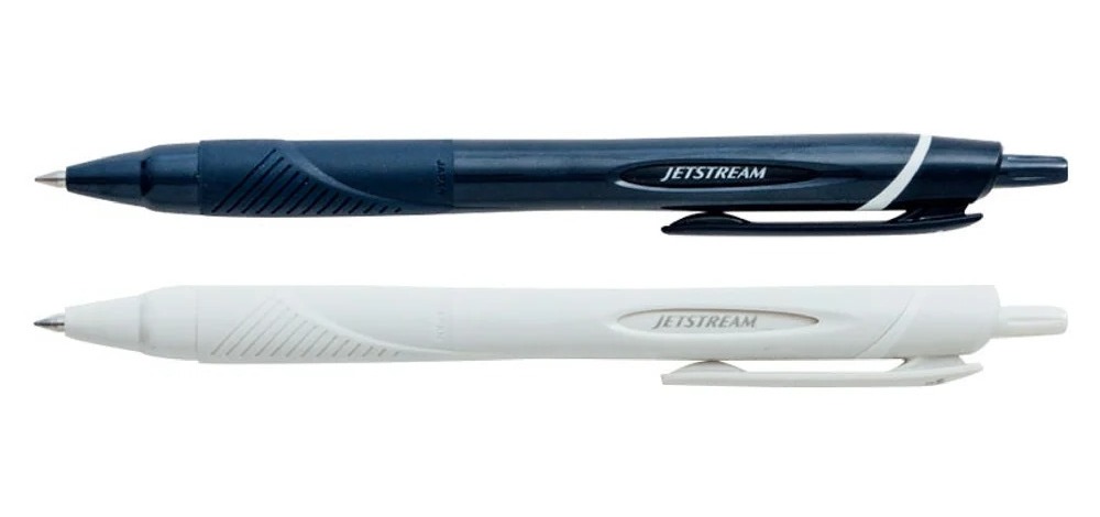 Navy and white JETSTREAM Elements ballpoint pens lying side by side.