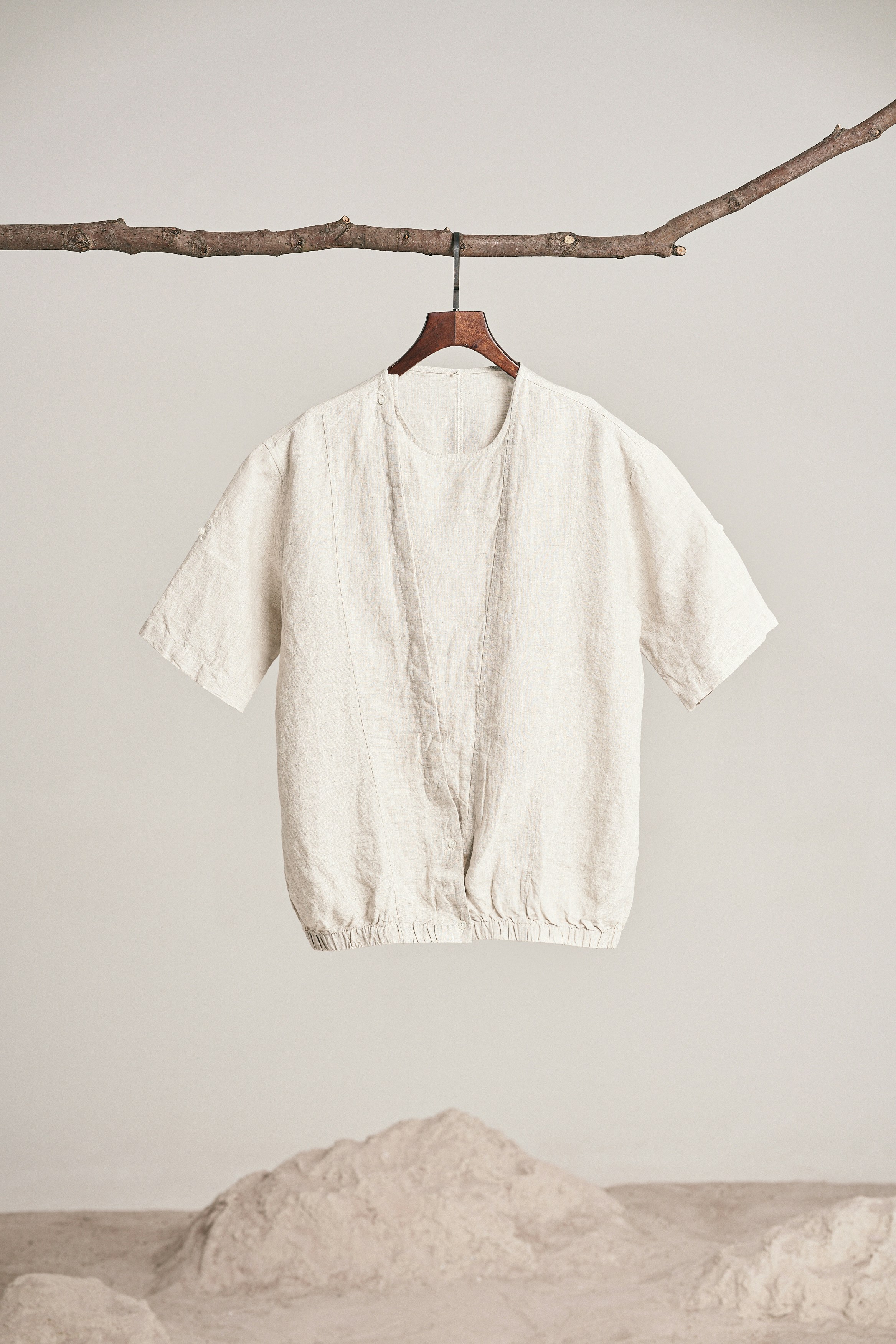 Beige shirt.