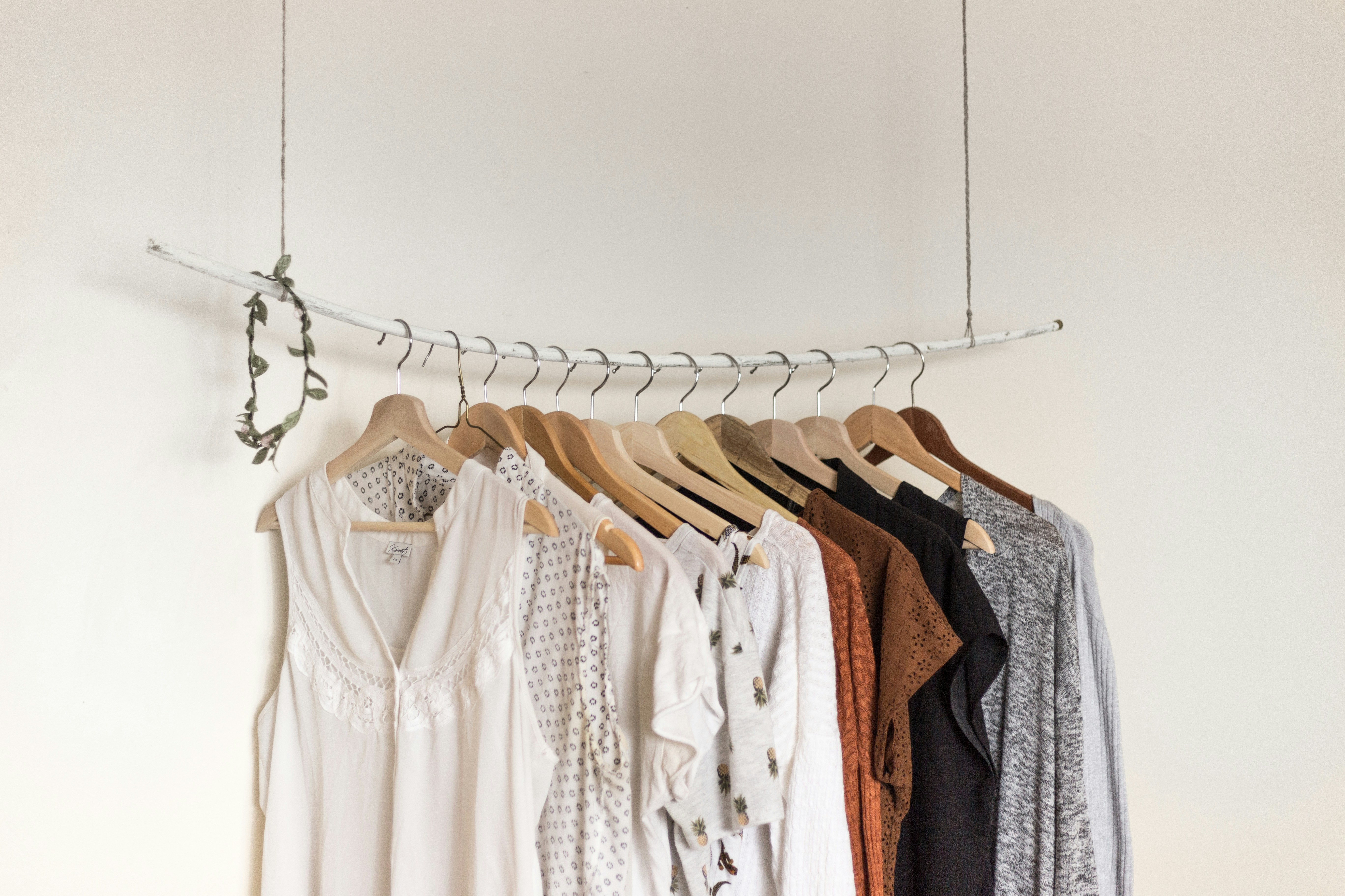 Rolling rack full of clothes.